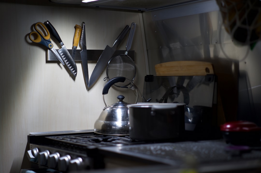 kitchen-counter-with-knives-scissors-and-kettle-anngfhvsmsm